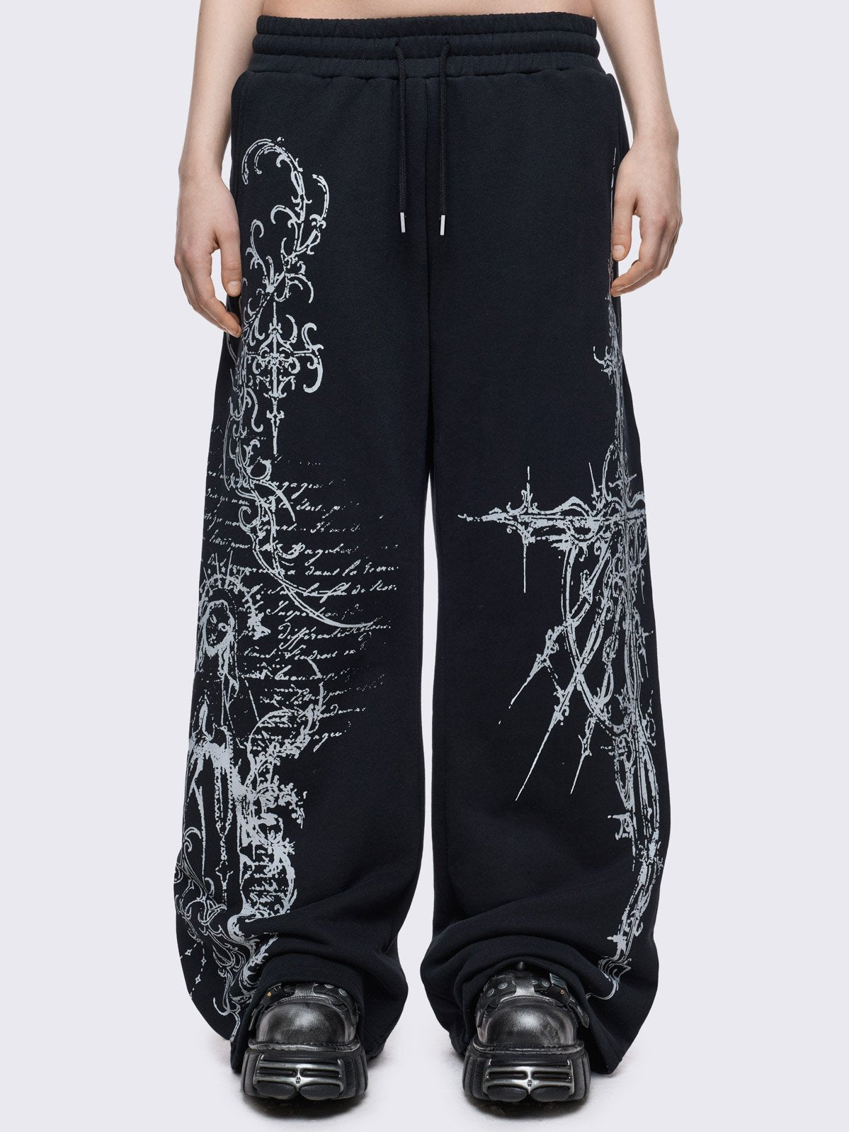 Black baggy sweatpants with white holy sigilism graphic print.
