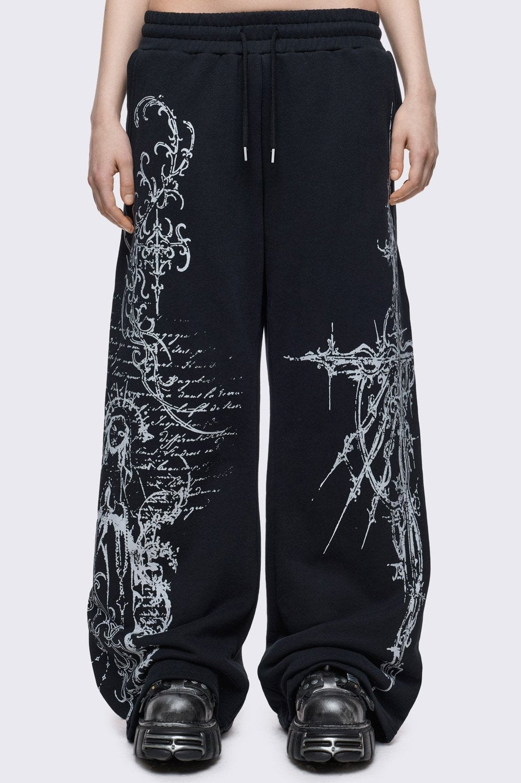 Black baggy sweatpants with white holy sigilism graphic print.