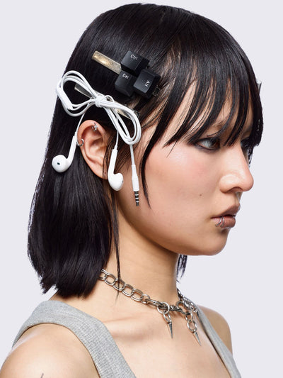 Set of 4 hair clips: Earbuds, keyboard, retro MP3 and circuit board designs.