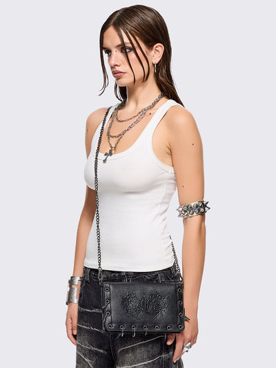 Black faux leather wallet with sigilism embossed graphic and silver eyelet and O-ring details.