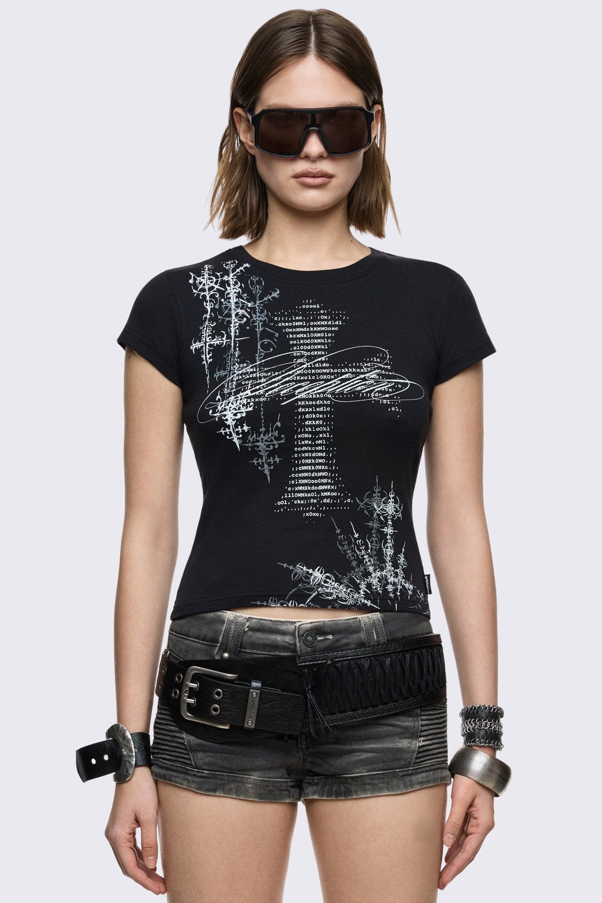 Black cotton baby tee with cross and sigilism graphic print, fitted short-sleeve goth grunge style.
