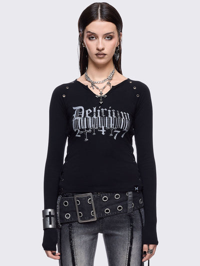 Black long sleeve top with "delirium" graphic front print, lace-up sides and silver eyelet details. 