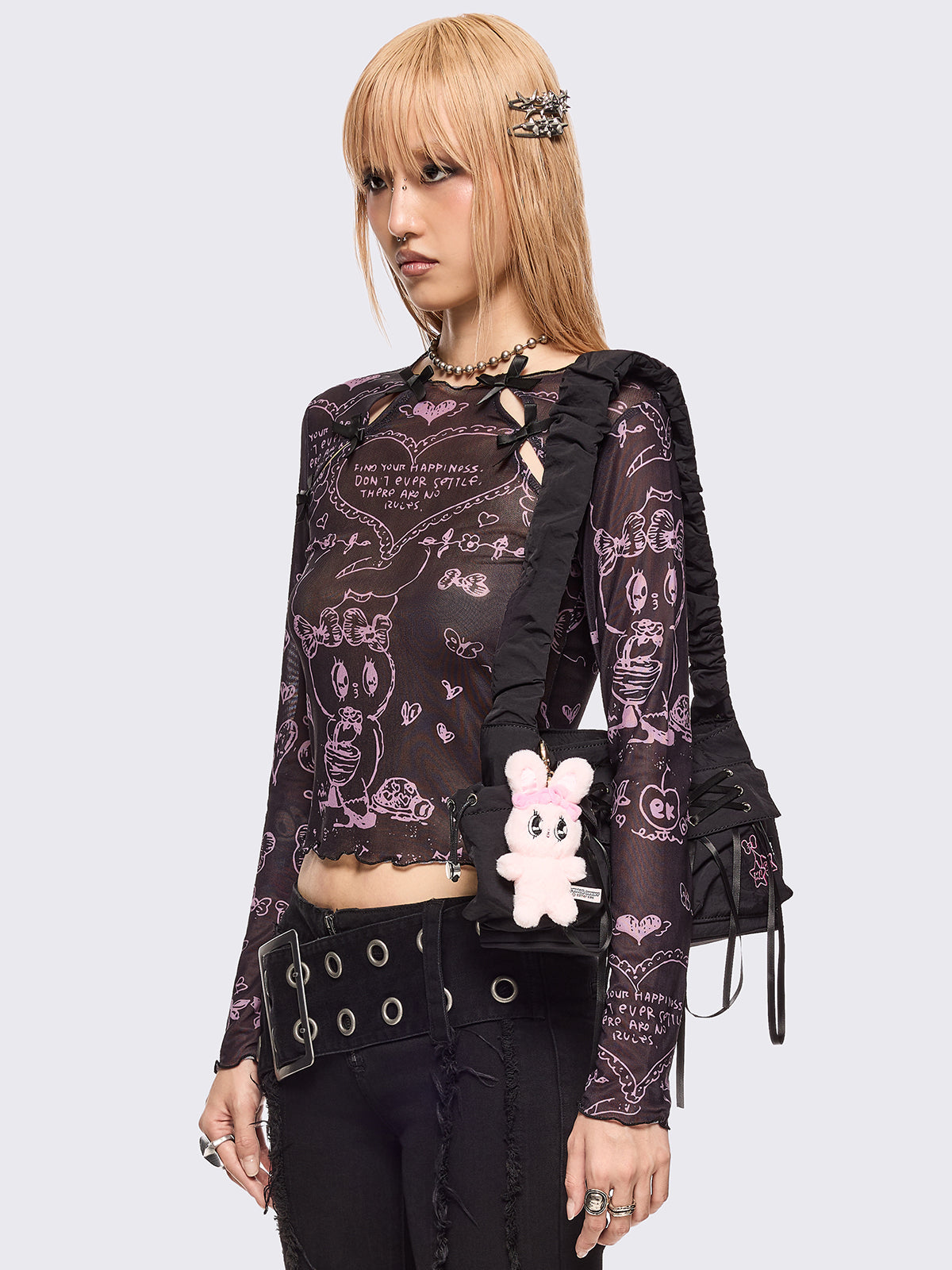 Black mesh top with all over pink graphic print by Esther Bunny artist and cut out details with bows.