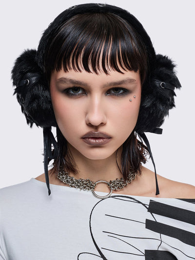 Black faux fur earmuffs and silver eyelet and lace up details.