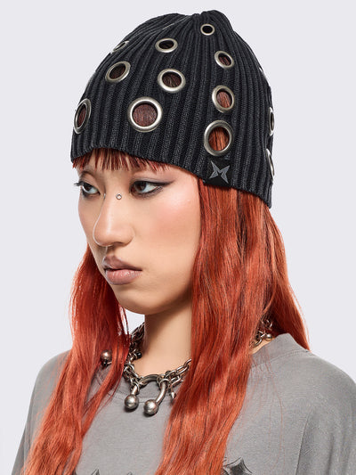 Black ribbed knit beanie with chunky silver eyelets.