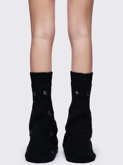 Black knitted flare leg warmers with chunky silver eyelets