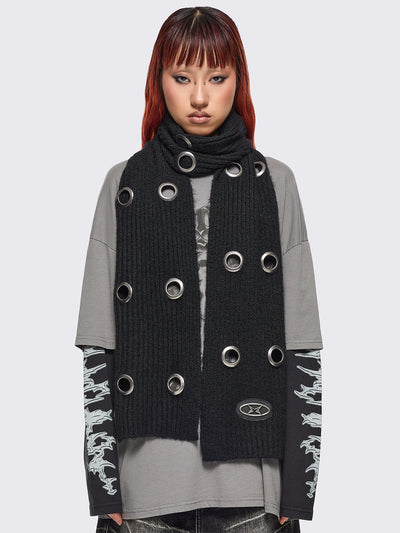 Black knitted scarf with chunky silver eyelets.