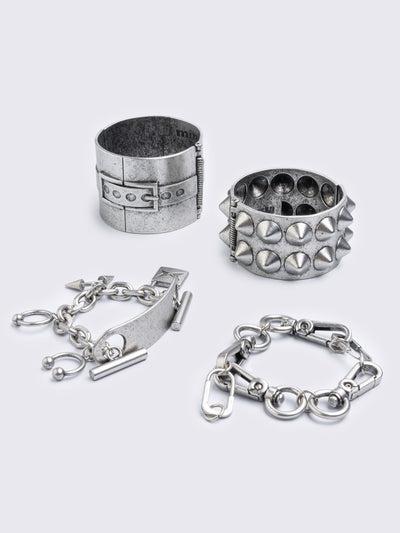 Set of 4 bracelets featuring spike, chain, locker and piercing details.