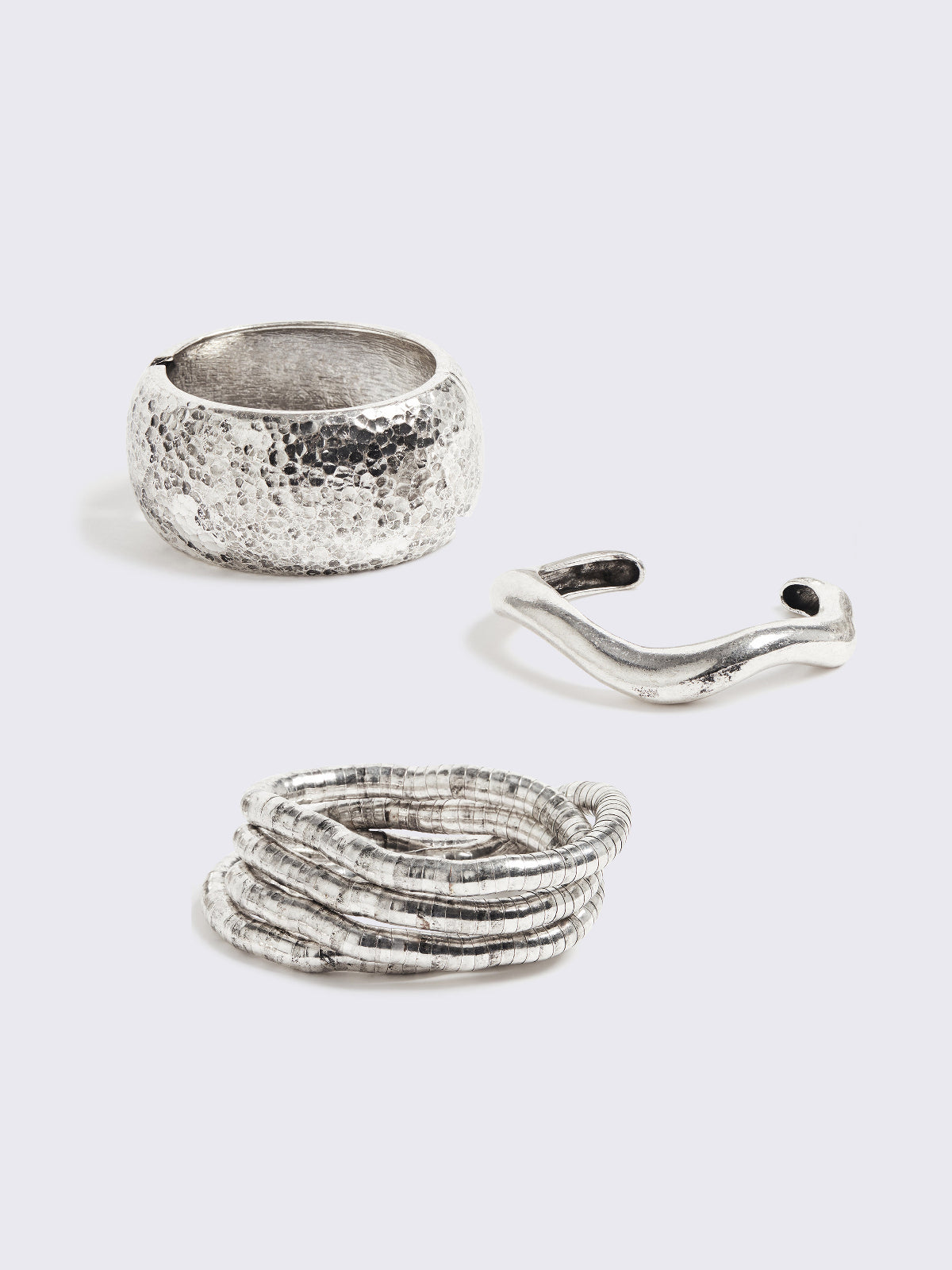 Set of 3 silver bracelets: textured, cuff and moldable snake bracelets.