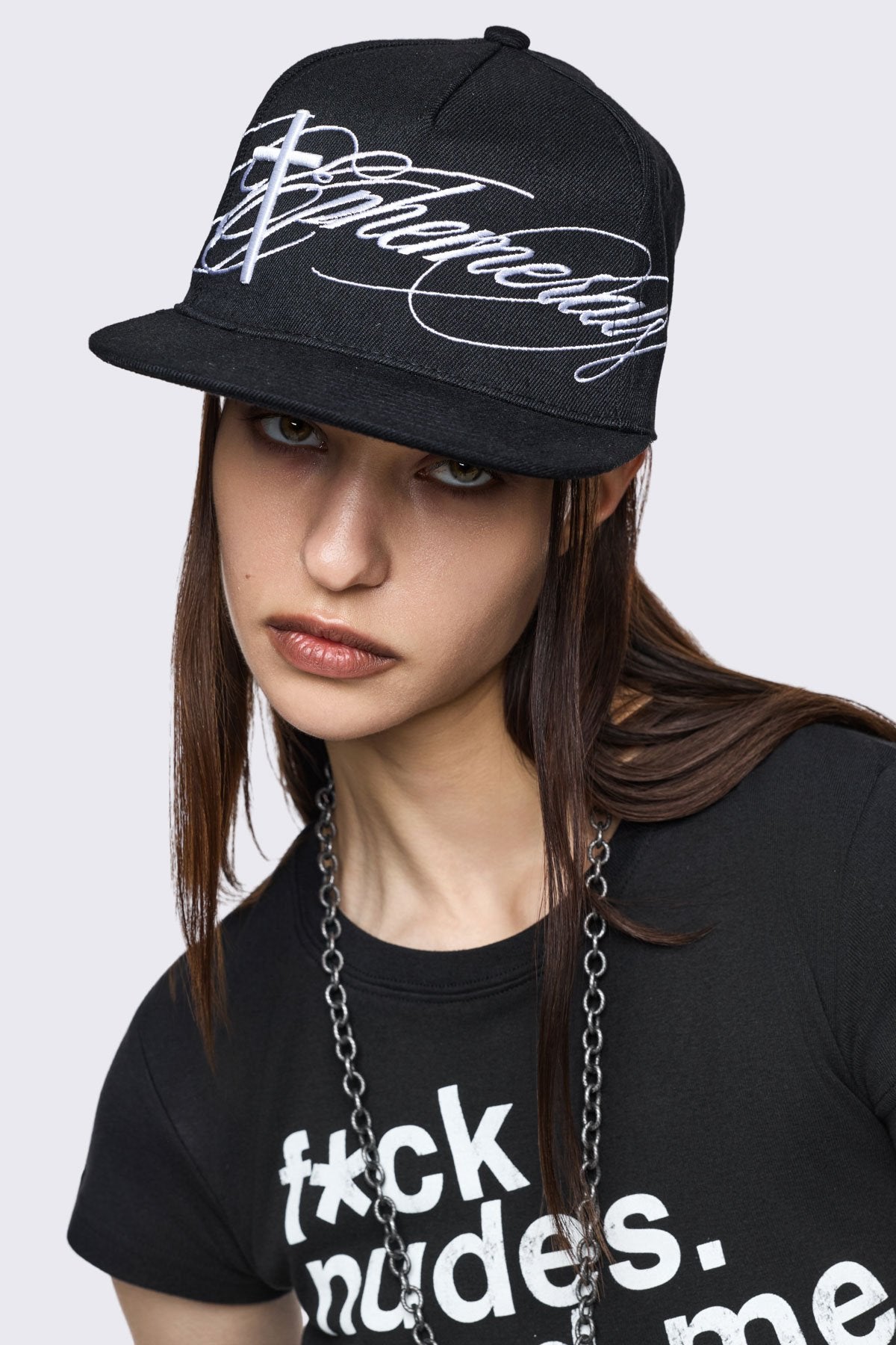 Black cotton flat brim cap with Ephemeral cross embroidery, grunge streetwear vibe.