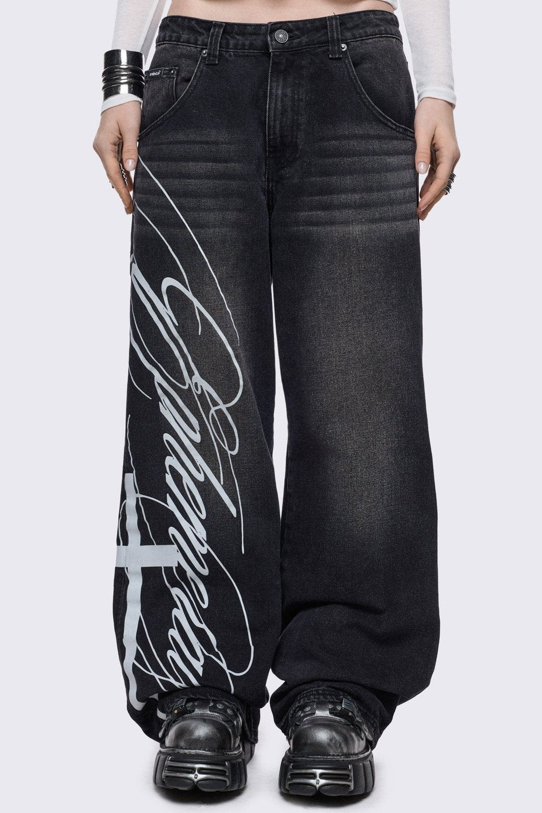 Black washed baggy jeans with white "ephemeral" cross side print
