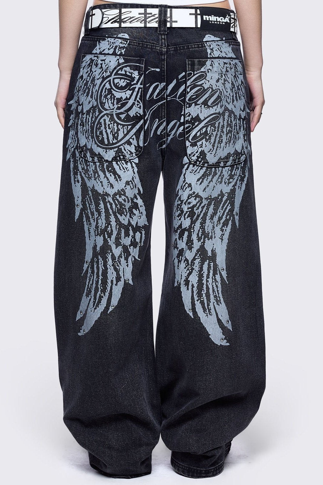 Black washed baggy jeans featuring a "Fallen Angel" winged graphic back print.