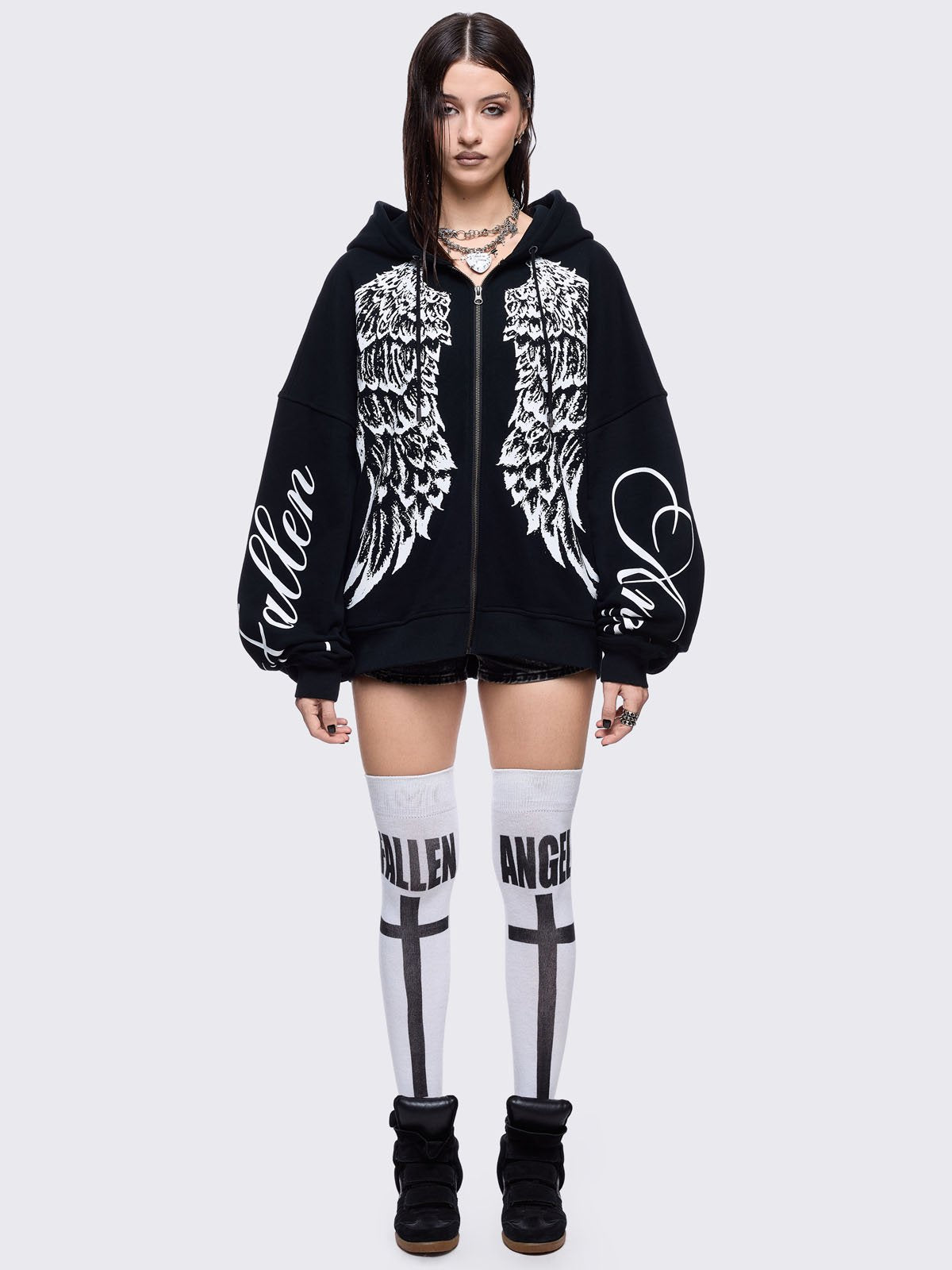 Black zip up hoodie jacket featuring a white wings graphic front print and "fallen angel" on sleeves