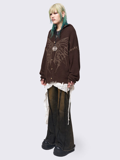 Brown chunky knit hooded cardigan featuring a dark beige butterfly graphic on the front. Includes contrast lace-up details and distressed trims for a fairy core stylish, edgy look.