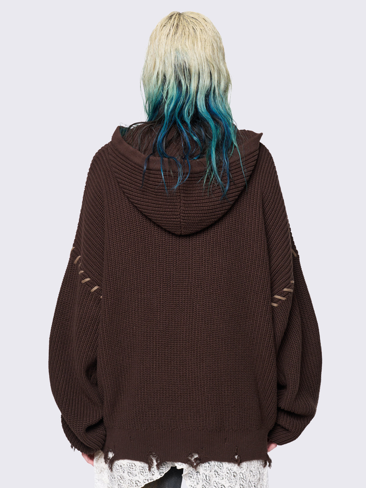 Brown chunky knit hooded cardigan featuring a dark beige butterfly graphic on the front. Includes contrast lace-up details and distressed trims for a fairy core stylish, edgy look.