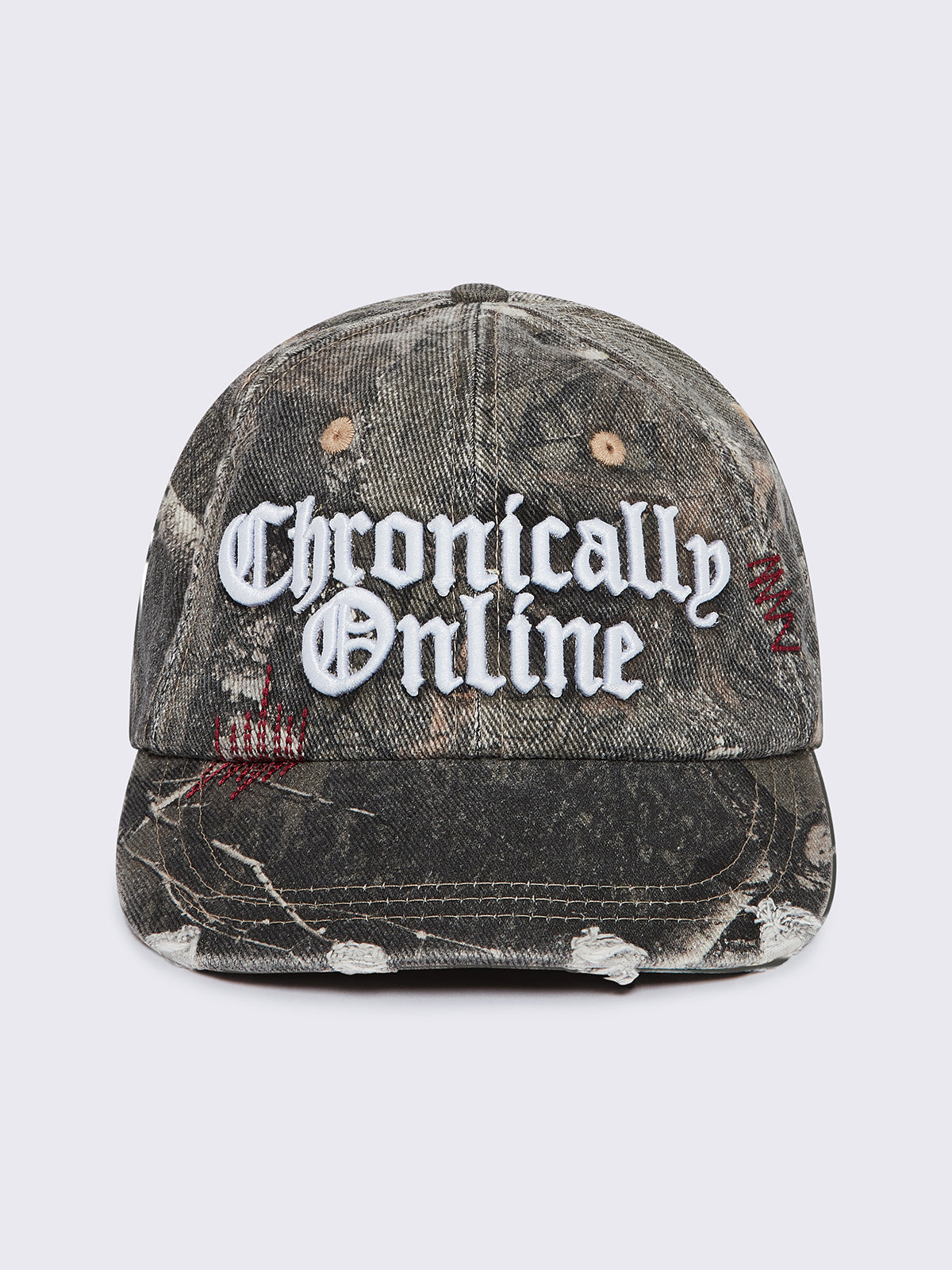 Forest tree como print denim baseball cap with "Chronically online" chunky embroidery and distressed details.