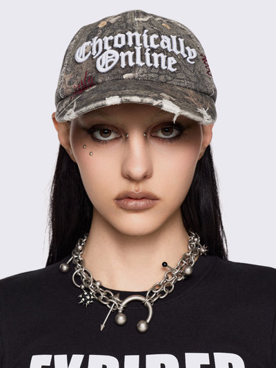 Forest tree como print denim baseball cap with "Chronically online" chunky embroidery and distressed details.