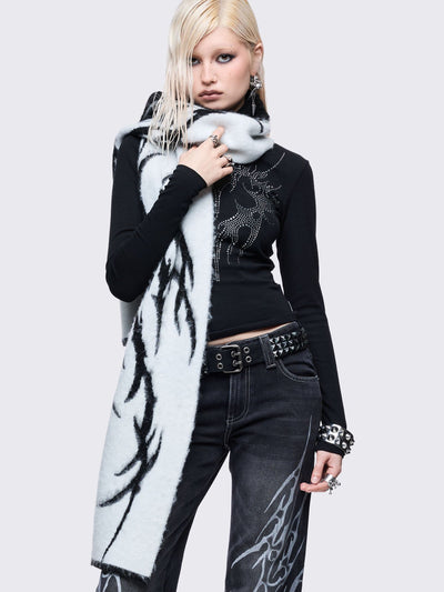 ong, chunky, and fluffy scarf featuring a high-contrast diffused tribal sigil pattern in black and grey