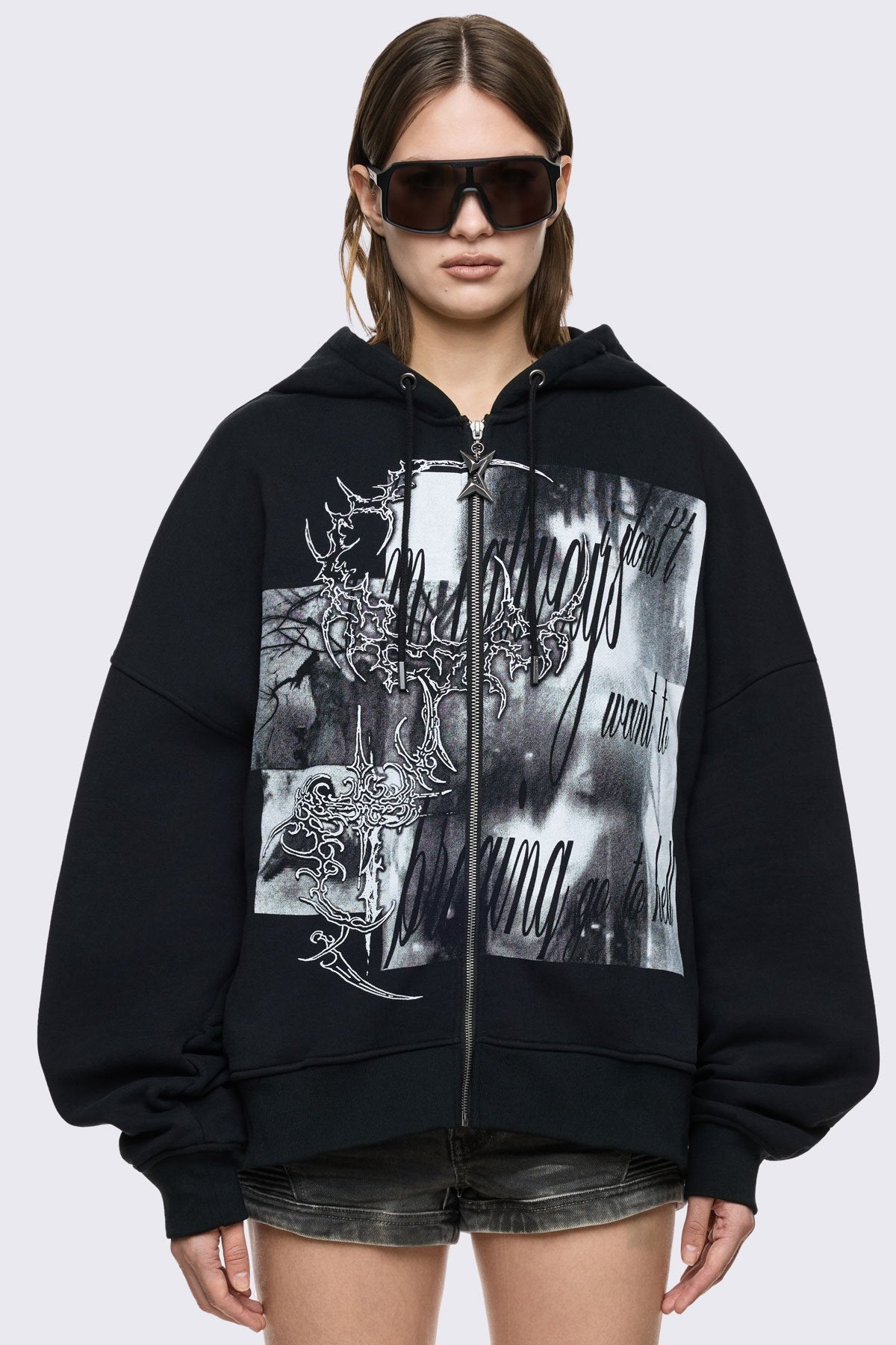 Black cotton zip up hoodie with oversized fit, gothic grunge graphic print and star zip detail.