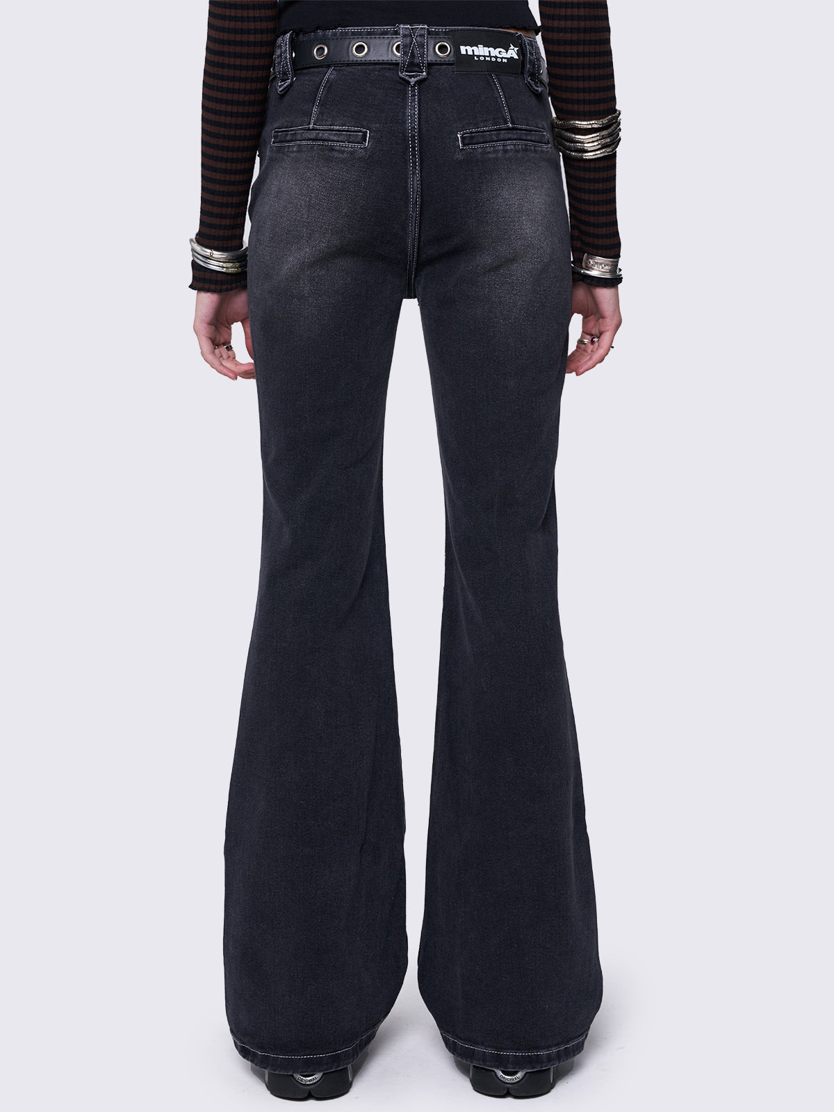 Flared overdye jeans in washed black.