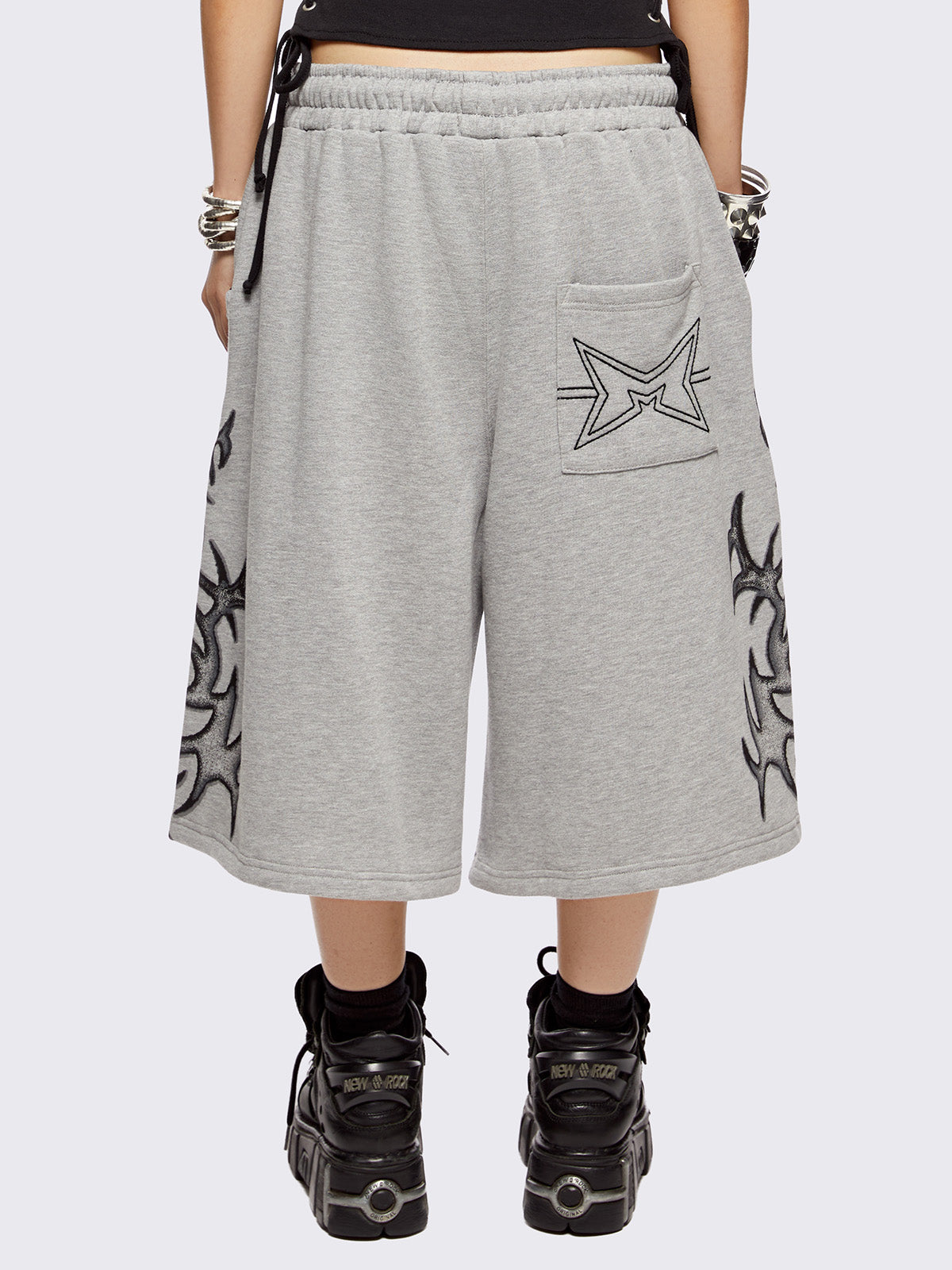 Grey oversized longline sweat shorts with sigilism graphic print.