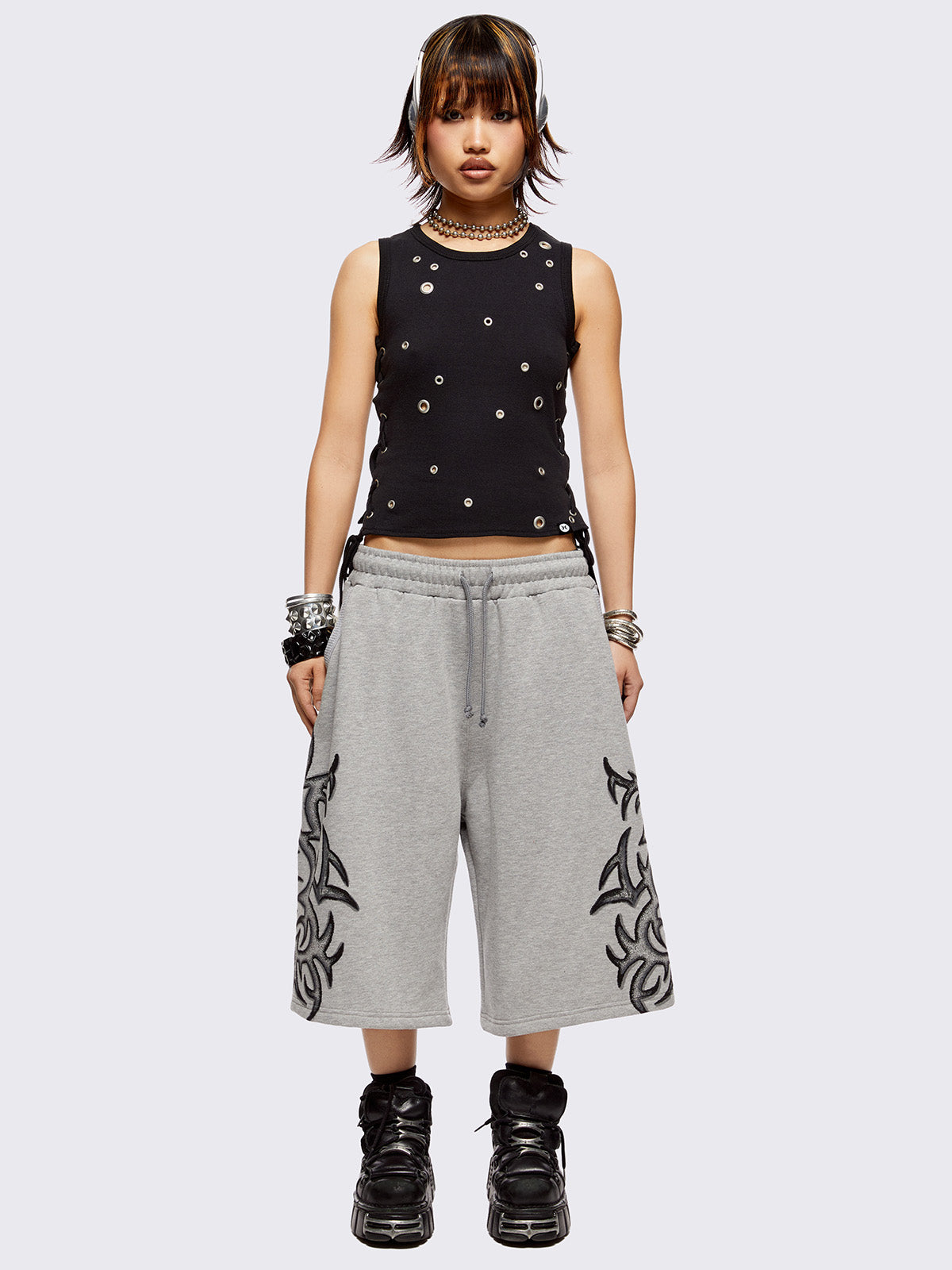 Grey oversized longline sweat shorts with sigilism graphic print.
