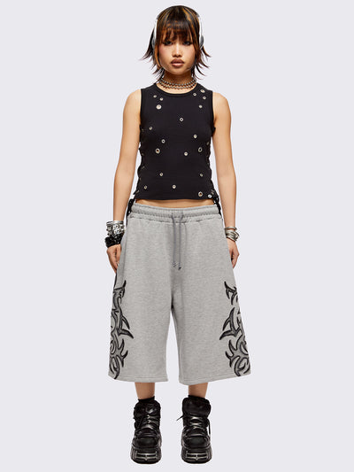 Grey oversized longline sweat shorts with sigilism graphic print.