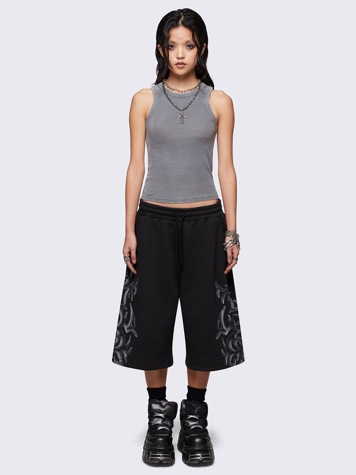 Black oversized longline sweat shorts with sigilism graphic print.