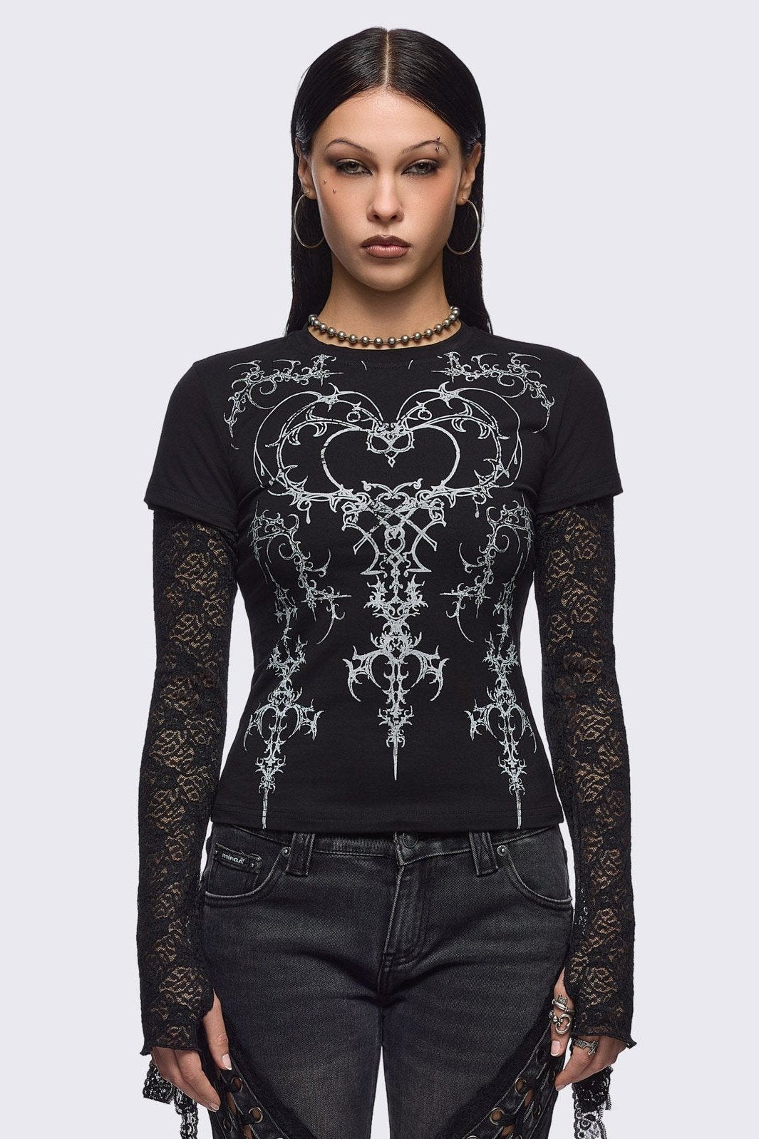 Black layered long sleeve baby tee featuring a grunge sigilism graphic front print and lace contrast sleeves with thumbhole cuffs.
