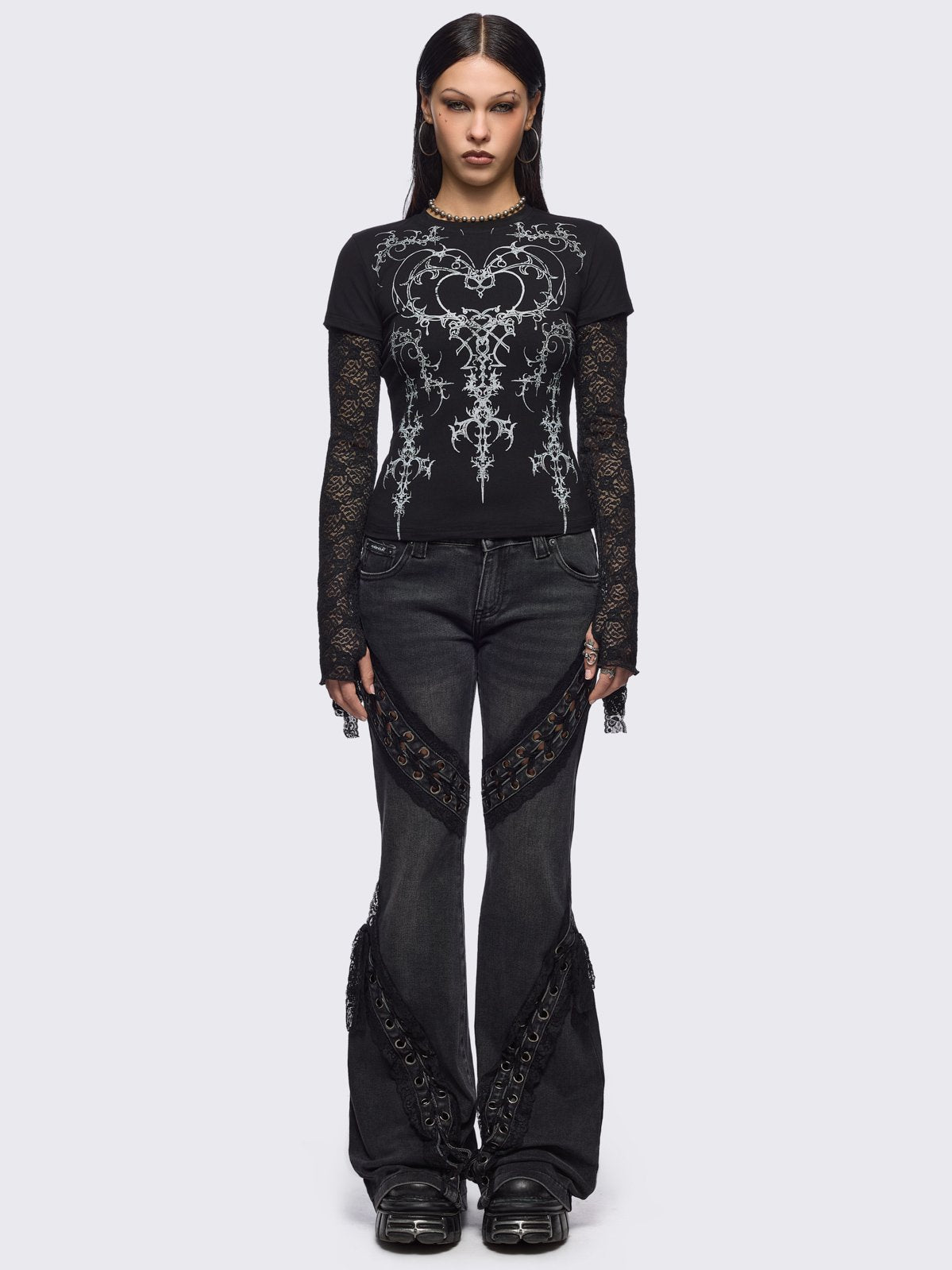 Black layered long sleeve baby tee featuring a grunge sigilism graphic front print and lace contrast sleeves with thumbhole cuffs.