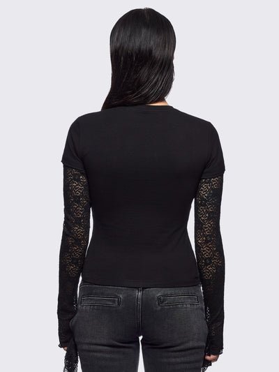 Black layered long sleeve baby tee featuring a grunge sigilism graphic front print and lace contrast sleeves with thumbhole cuffs.