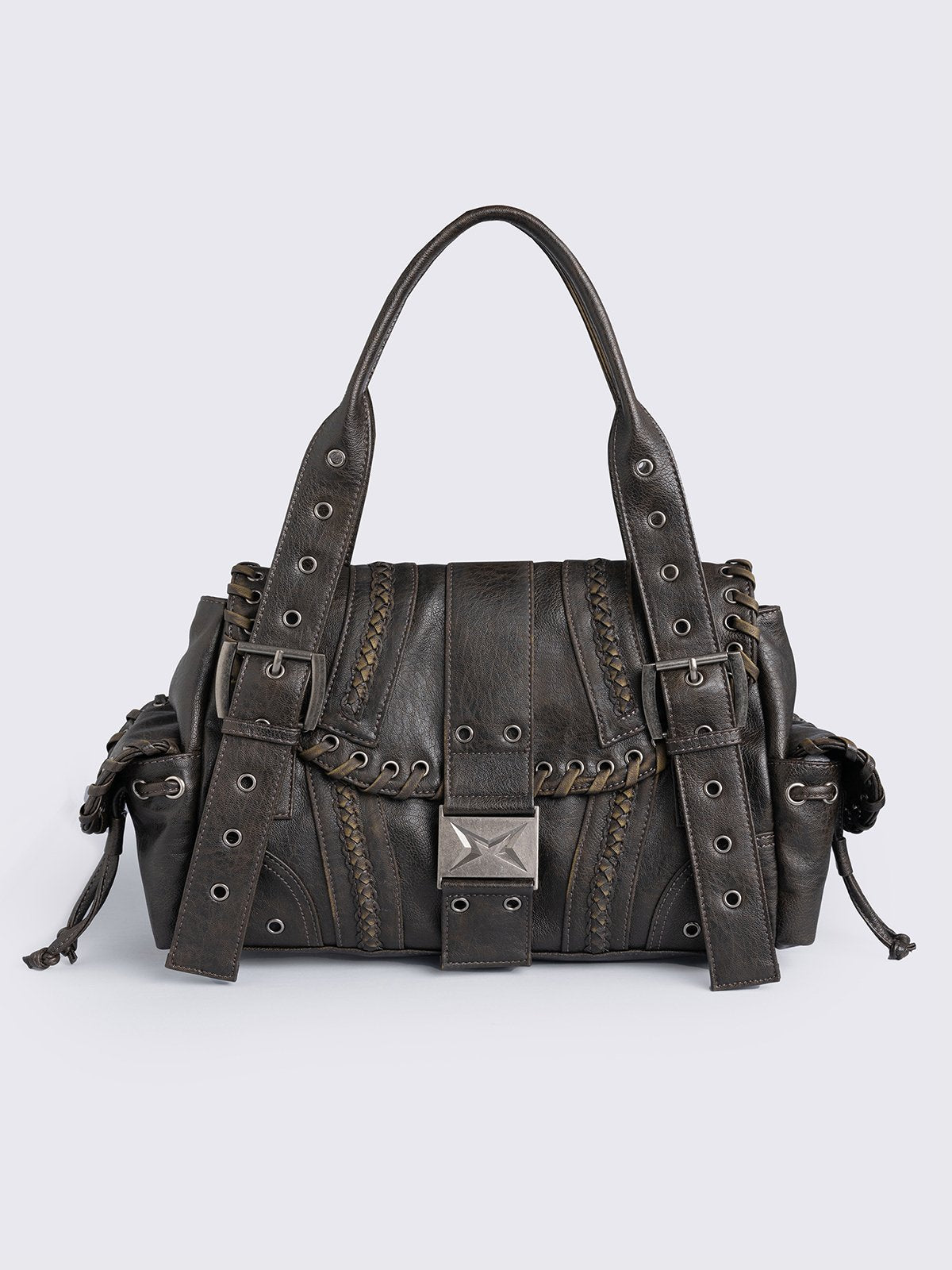 Brown faux leather shoulder bag featuring lace ups, eyelets, buckles and multiple pockets.