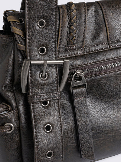Brown faux leather shoulder bag featuring lace ups, eyelets, buckles and multiple pockets.