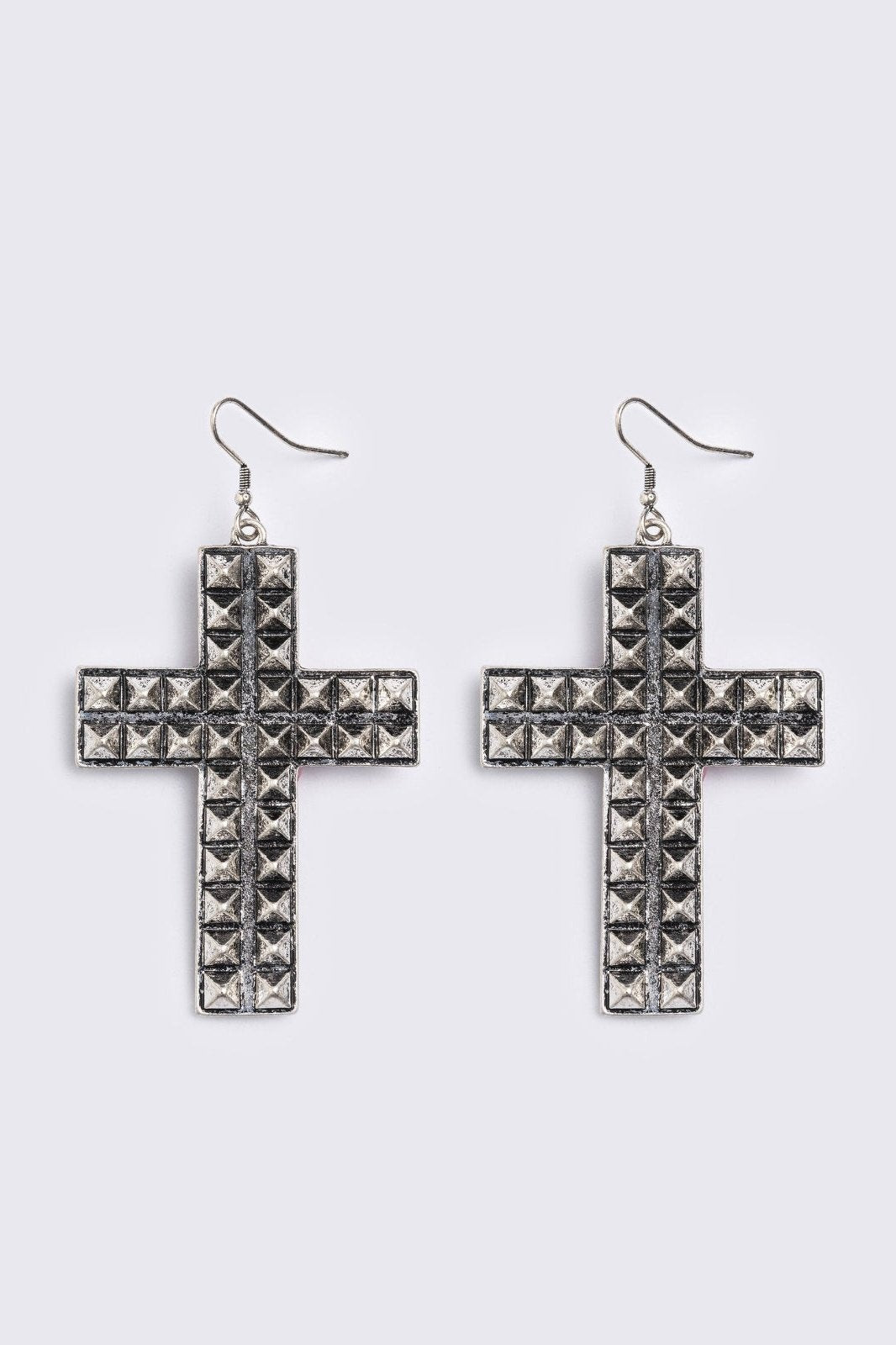 Silver dangle earrings featuring a studded cross design pendants