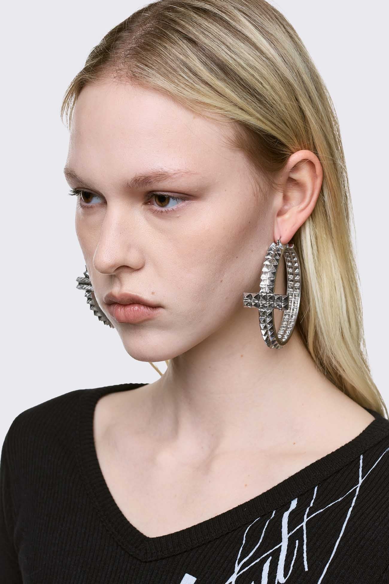 Silver chunky studded cross hoop earrings.