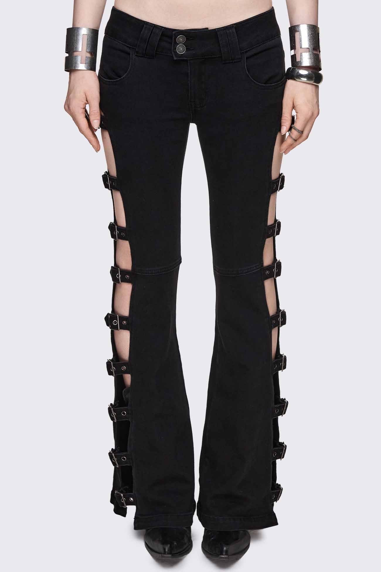 Black low rise flared jeans with buckle-strap side cut-outs and silver-tone hardware.