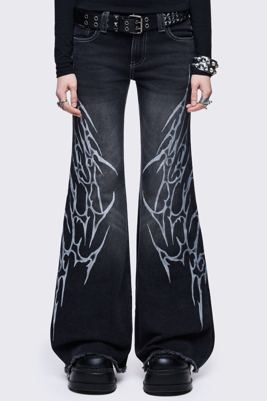 Black washed flared jeans with sigilism side print.
