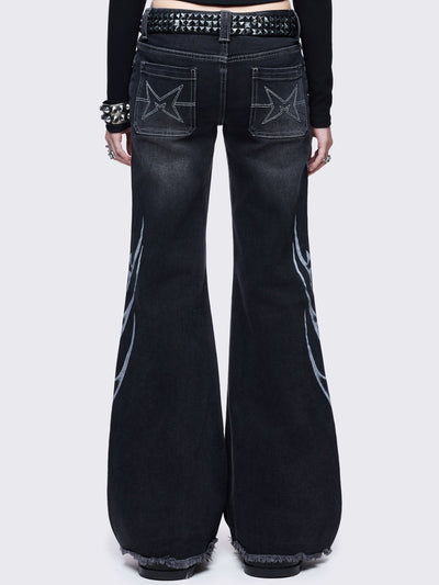 Black washed flared jeans with sigilism side print.
