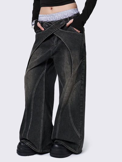 Black washed baggy jeans with green overdye and cross panels and seams details. 