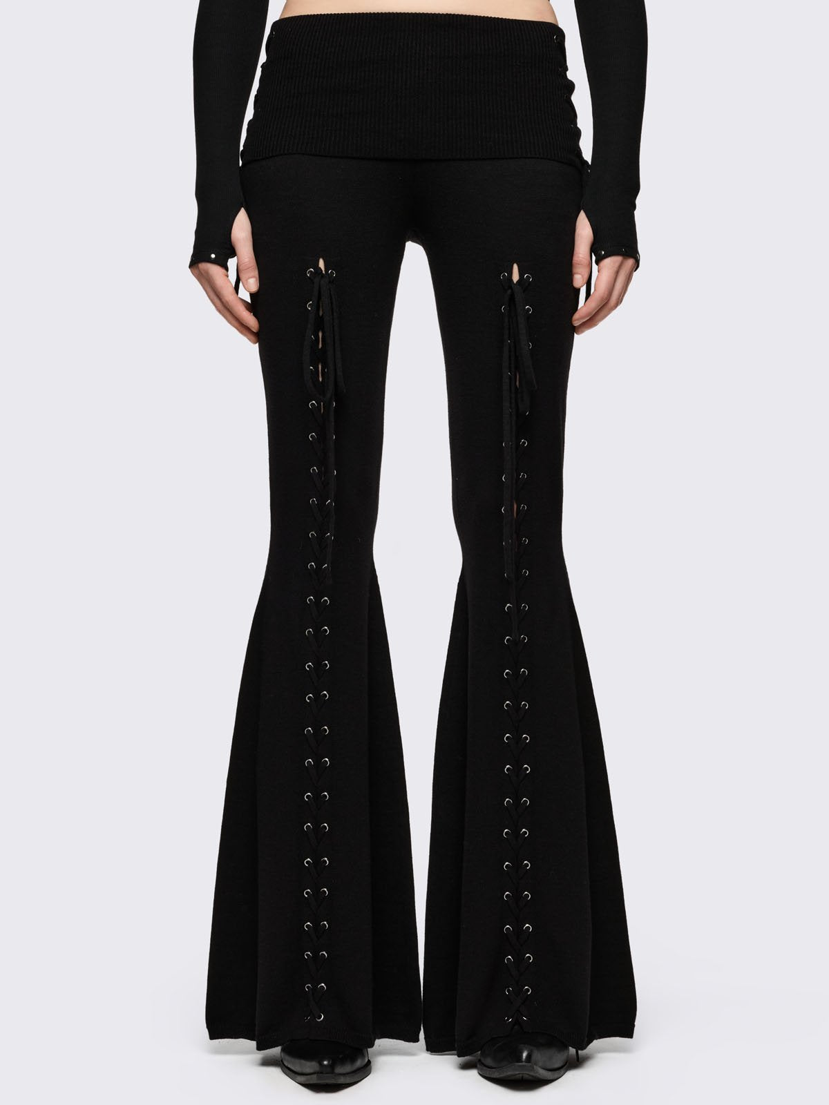 Black flare pants with front open lace-up corset details. 