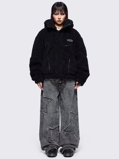 Black fleece hoodie jacket featuring grey piping and high neck hood.