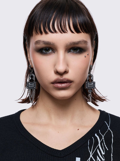 Chunky silver padlock pendant hoop earrings.