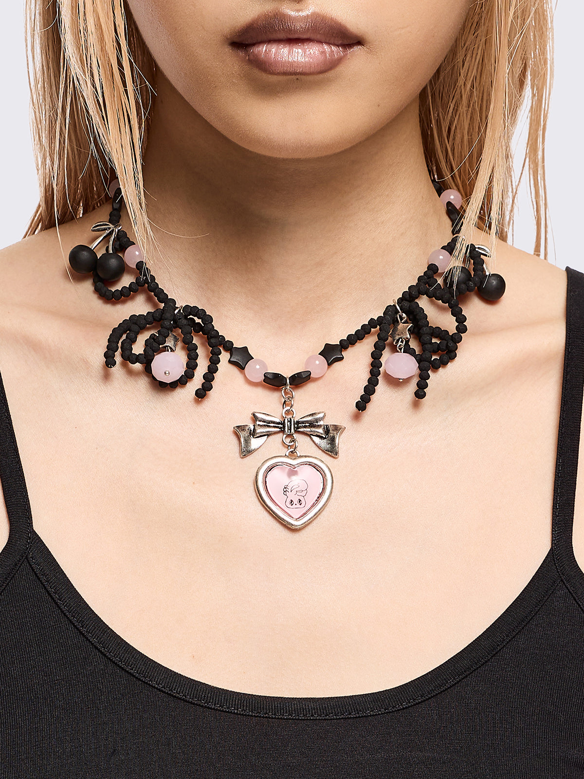 Black beaded necklace with pink heart locket with bunny print by esther bunny artist and back cherry pendants.