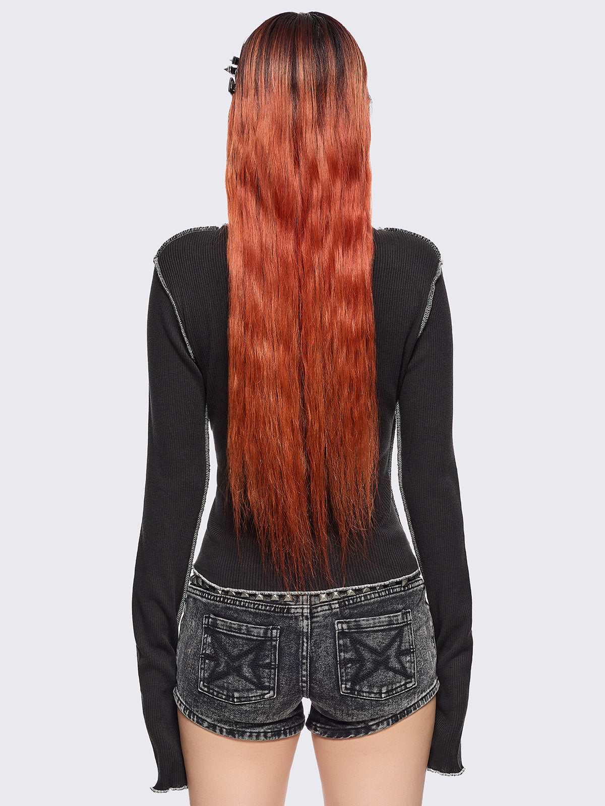 Black ribbed long sleeve top featuring a malefic eyes graphic front print, thumbhole cuffs and white reverse stitching. 
