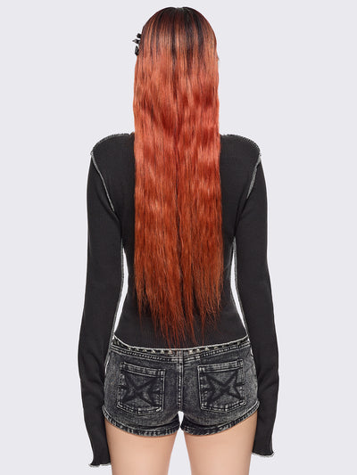 Black ribbed long sleeve top featuring a malefic eyes graphic front print, thumbhole cuffs and white reverse stitching. 