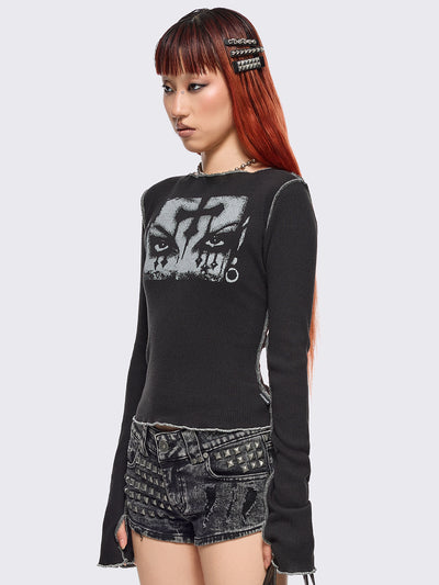Black ribbed long sleeve top featuring a malefic eyes graphic front print, thumbhole cuffs and white reverse stitching. 