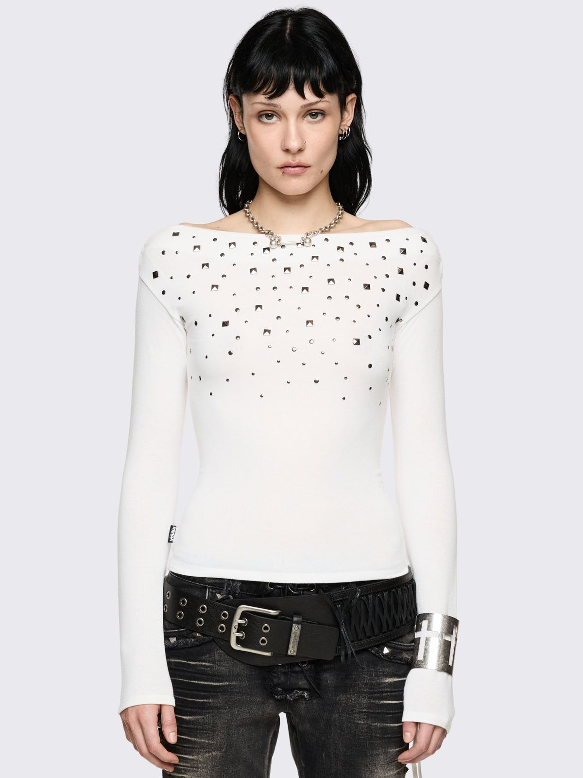 White off-shoulder long sleeve top and stud details.  