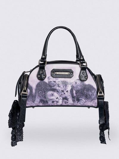 Black and pink bowling bag with kittens graphic print, rhinestone details and side exterior pockets with lace up bows.