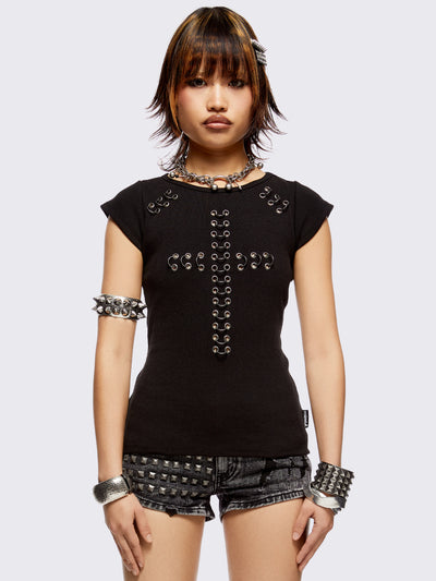 Black baby tee with pierced silver cross. Grunge goth vibes. 