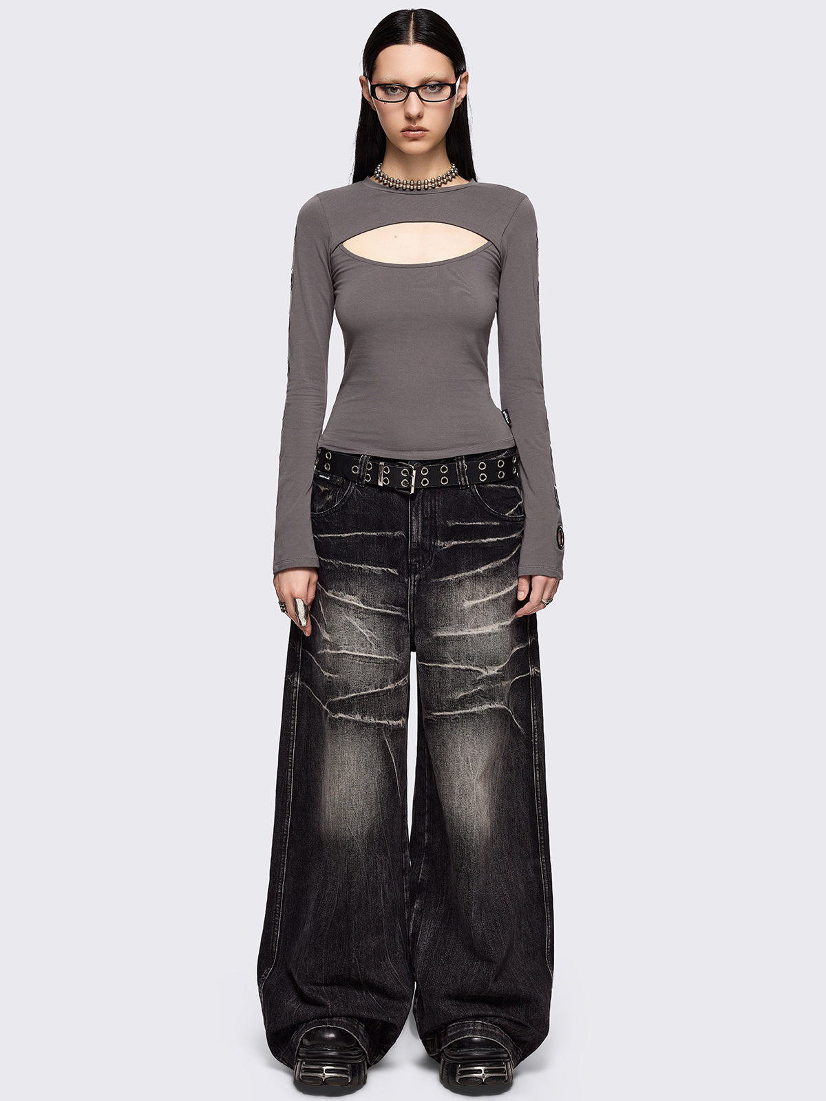 Grey cut-out long sleeve top with chunky silver eyelets on sleeves.